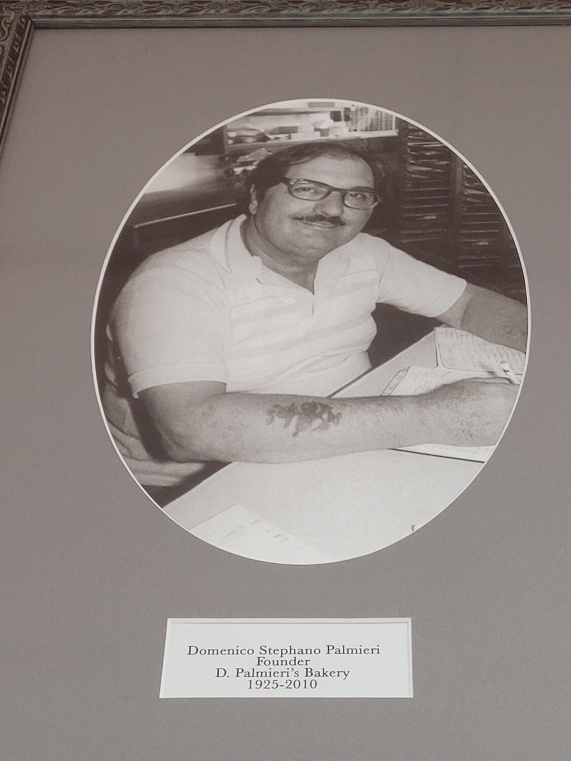 PIZZA PORTRAITS: Photographs of the founders of D. Palmieri’s Bakery in Johnston hang on the wall; master pizza makers forever watching their ancestors continue their craft, with the same, cherished, more than century-old recipes.